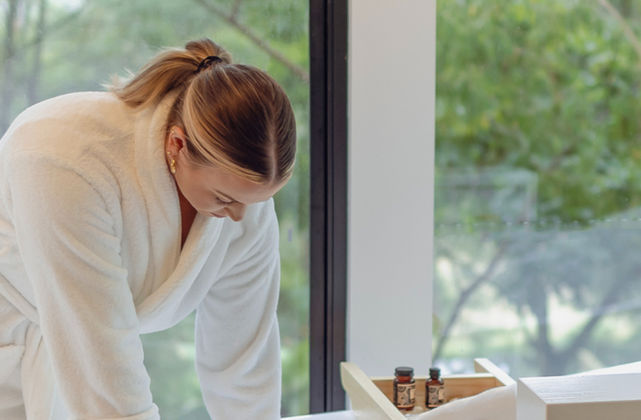 Spa-style private bathhouse with infrared sauna and freestanding bath