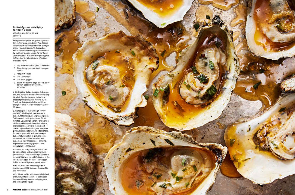 Close-up of grilled oysters in their shells coated with melted spicy tarragon butter.