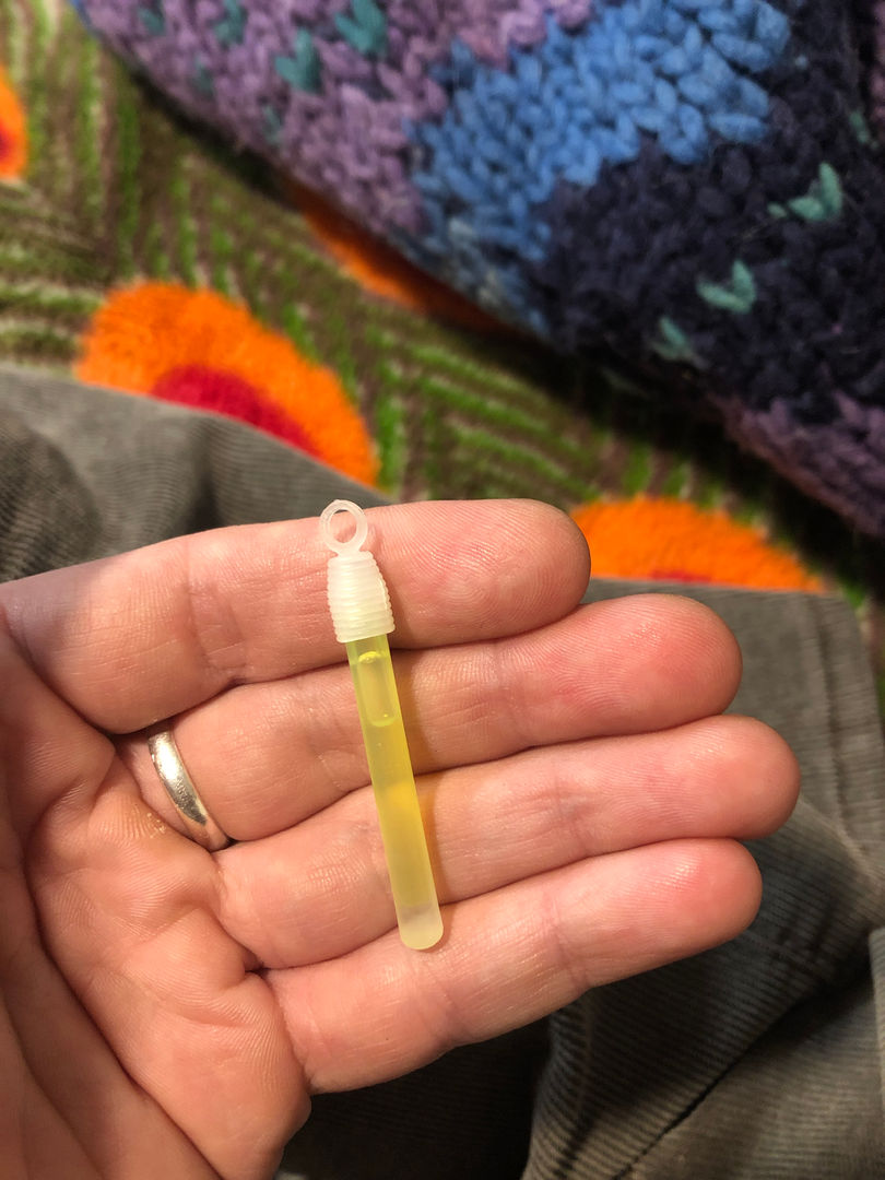 in repairing a friend's sweater that he used to wear to grateful dead shows, i found this baby glow stick in the pocket. it wasn't even cracked yet