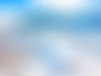 Snow-covered village with wooden houses, red lanterns on trees, and a mountain backdrop. Bright, clear sky creates a serene winter scene.