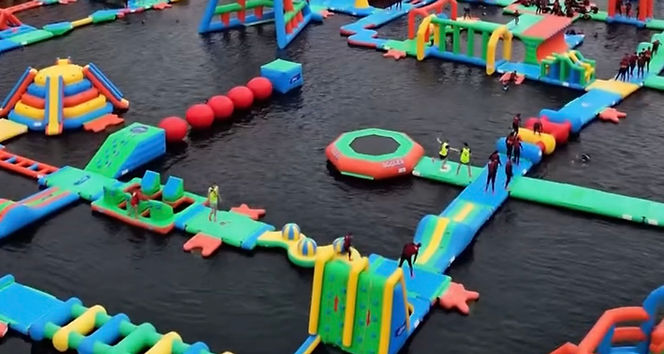 The Lake Kilrea is one of Ireland's premier outdoor adventure destinations, offering an unforgettable day out for families, friends, and thrill-seekers of all ages. Whether you're looking for high-energy fun on the water or a relaxing day surrounded by beautiful scenery, there's something for everyone to enjoy.
Home to Ireland's largest inflatable waterpark, the impressive 80,000 sq ft aqua park stretches across an 11-acre freshwater lake and is packed with giant slides, towering climbing obstacles, wipeout balls, swirly bridges, and much more. Suitable for ages 6 and over, it's the perfect place to splash, climb, jump, and challenge yourself.
Visitors can also enjoy paddleboarding, kayaking, and open-water swimming, or simply unwind with a lakeside walk, soak up the stunning views, and relax with a coffee and cake while watching the action unfold.
Whether you're planning an action-packed family adventure or a peaceful escape in nature, The Lake Kilrea offers a fantastic day out that keeps visitors coming back time and time again.