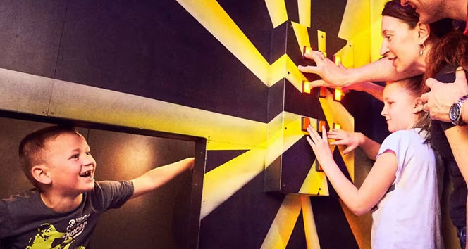 Looking for an unforgettable challenge? Prison Island Belfast offers a unique indoor adventure inspired by the famous Crystal Maze, combining physical challenges, teamwork, and brain-teasing puzzles in one action-packed experience.
Work together in teams of 2–5 to tackle 31 prison-themed challenge cells, each testing your skill, logic, memory, or physical ability. You're never locked in, so you can move freely between cells, score as many points as possible, and see how your team ranks on the live leaderboard. Suitable for ages 9+, with children aged 6+ welcome when accompanied by an adult.
The fun doesn't stop there! Prison Island Belfast is home to four exciting attractions under one roof:
Prison Island – Take on 31 unique challenge cells that combine mental, physical, and skill-based tasks.
Think Box – Race against the clock to solve over 80 mind-bending puzzles hidden inside 12 interactive boxes.
Quiz Boxing – Step into the boxing ring for a fast-paced TV-style quiz where you'll battle friends and family using your knowledge, not your fists.
Interactive Axe Throwing – Test your aim with real axes and interactive digital targets featuring a range of fun games. (Ages 18+)
Whether you're visiting with family, friends, or celebrating a special occasion, Prison Island Belfast offers a one-of-a-kind experience packed with teamwork, excitement, and plenty of laughs.