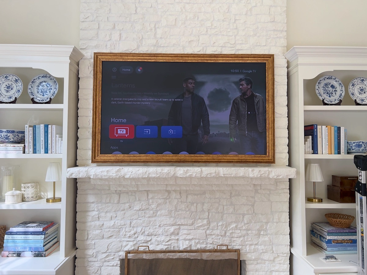 TCL NXTFRAME TV mounted above a fireplace in Alpharetta, GA