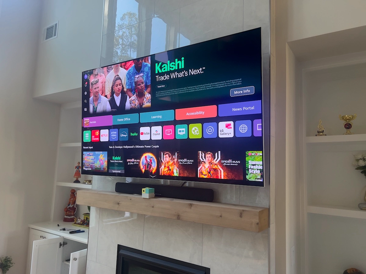 LG QNED TV mounted above a fireplace in Cumming, GA