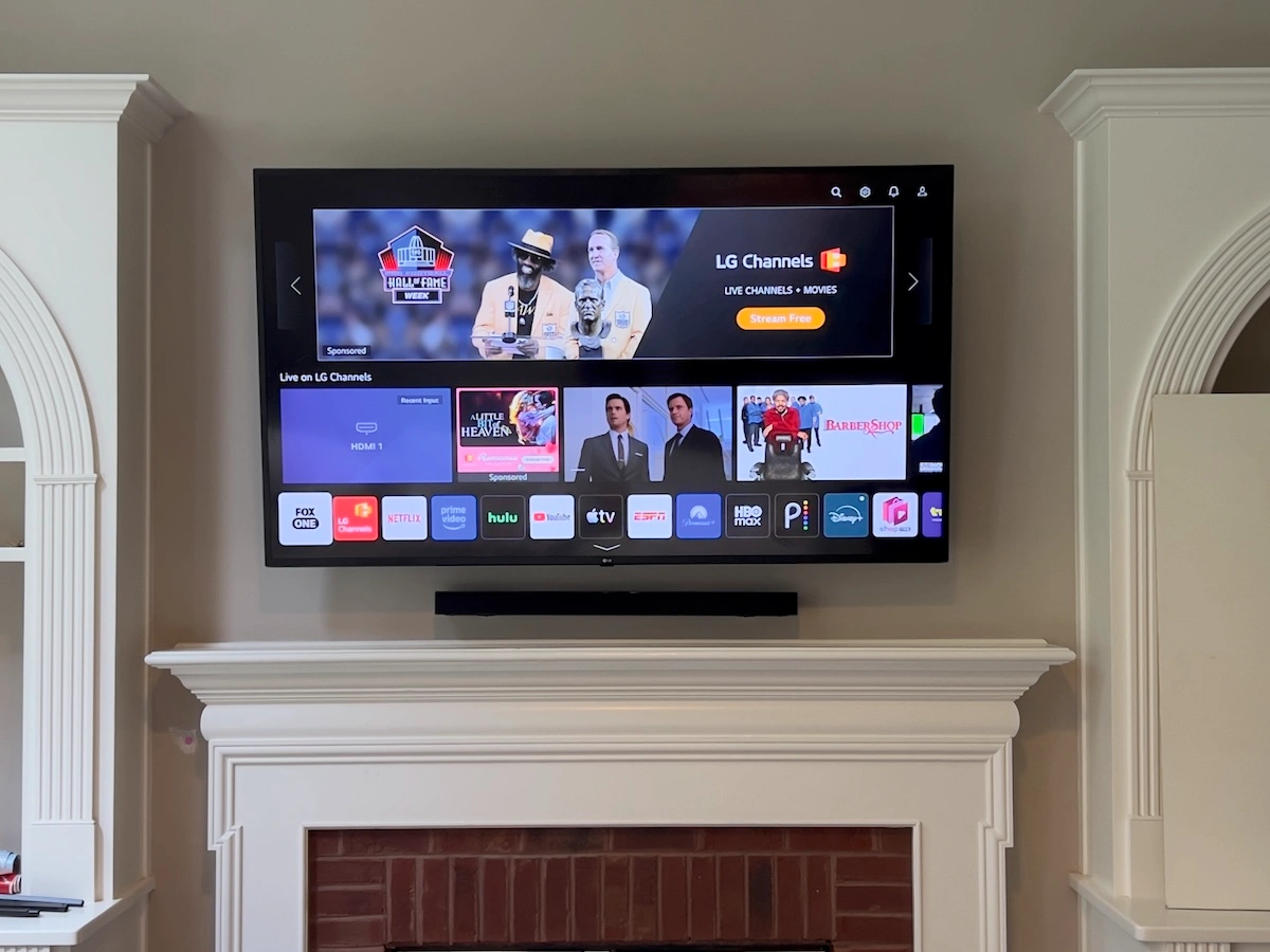LG + Soundbar TV mounted above a fireplace in Johns-Creek, GA