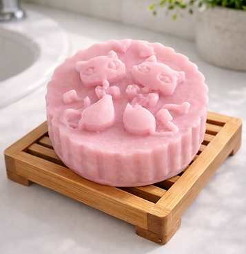 Pink Chaga Conditioner Bar sitting on Bamboo rack in a bathroom