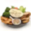 Blended Horseradish Bacon Spice Dip Mix in a bowl and surrounded by vegetables and crackers
