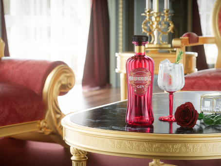 Red gin bottle, cocktail, rose, and jewelry box on ornate table. Luxurious setting with red and gold furniture, elegant and refined mood.