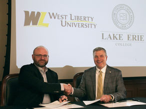 Dean of the School of Education at Lake Erie College Dr. Greg Rothwell (left) shakes hands with WLU President Dr. Tim Borchers (right)