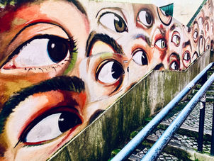 Painted eyeballs in an artistic mural, representing the brain's natural processing power during EMDR.