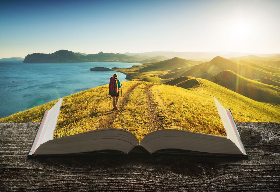 Girl hiker in a mountain valley on the pages of an open magical book. Majestic landscape.