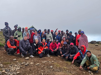 Leken Adventure porters, guides, cook, and our group of hikers posing at the Shira Camp Mount Kilimanjaro