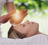 Woman having reiki healing treatment , alternative medicine, holistic care concept..jpg