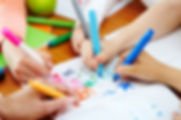 kids coloring together