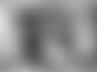 Black and white image of a café exterior with people sitting inside. Sunlight filters through trees, casting shadows. Text on window reads "arte, birras, sushi." Emo mood. Small business ethics by sheridan guerrette insights article and essay