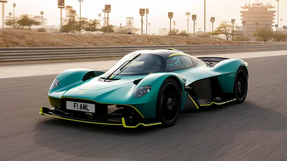 Eye-level view of Aston Martin Valkyrie parked on a coastal road