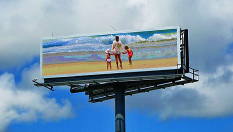 A Day at the beach exhibit on a full-size digital outdoor billboard in Atlanta, Georgia