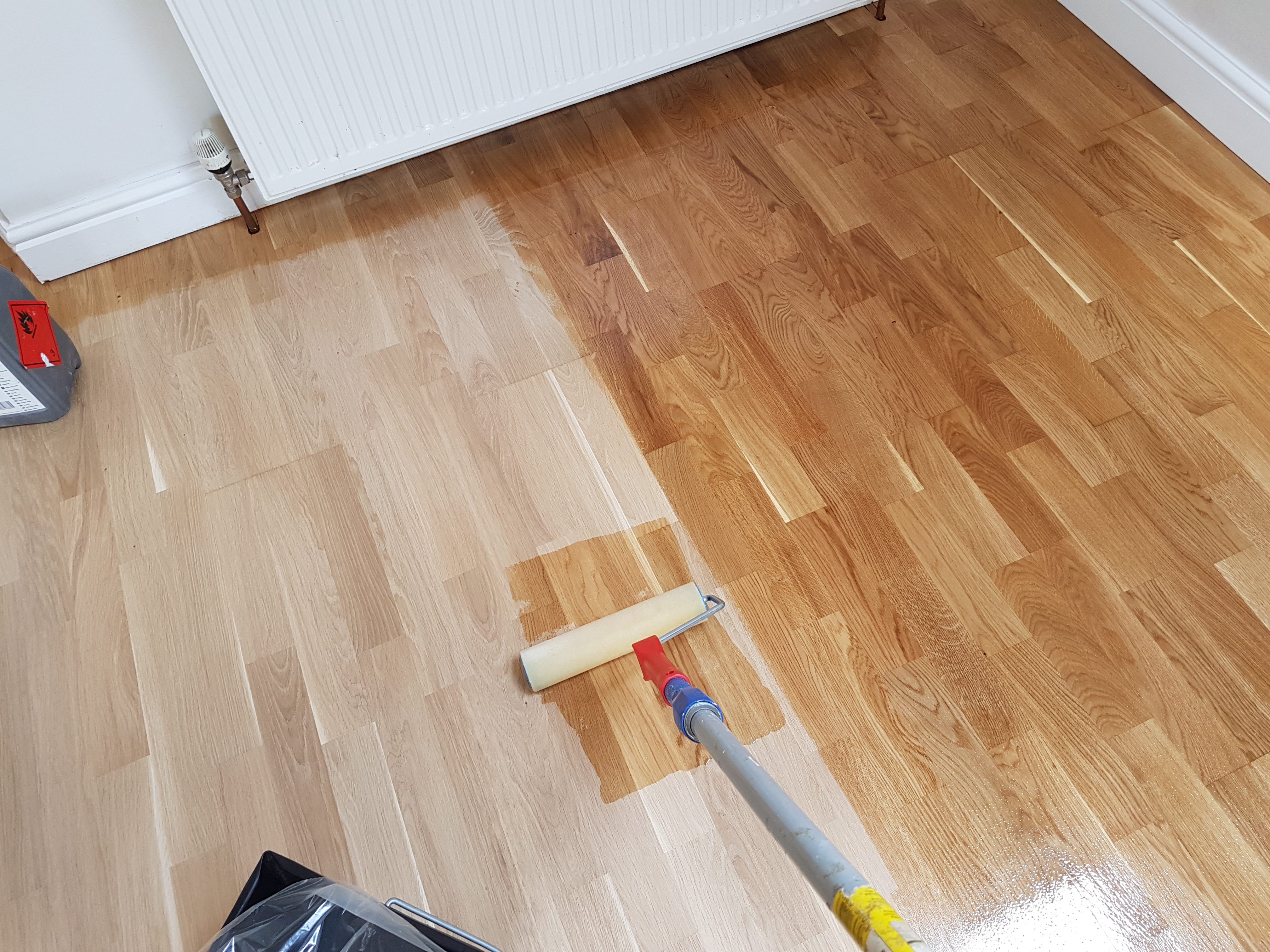 Oak floor being lacquered