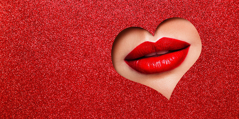 red sparkly paper with heart cutout womans red lips behind heart cutout
