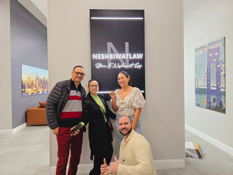David Parides giving the thumbs up with a group of his clients.