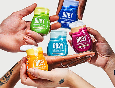 Hands holding Buoy Hydration Drops