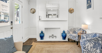 A fireplace in a sitting room at WillowBrook in Pensacola.