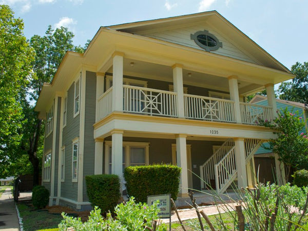 A street view of one of the nine unique and historical apartment buildings located in the heart of North Oak Cliff, The Homes of King's Way.