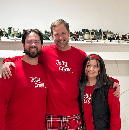 K. Patrick Anderson with his son and daughter wearing matching Christmas pajamas.
