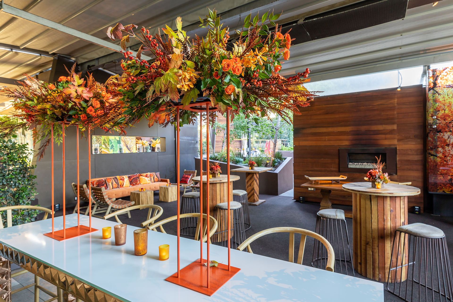 Autumnal floral centerpiece on modern white communal table