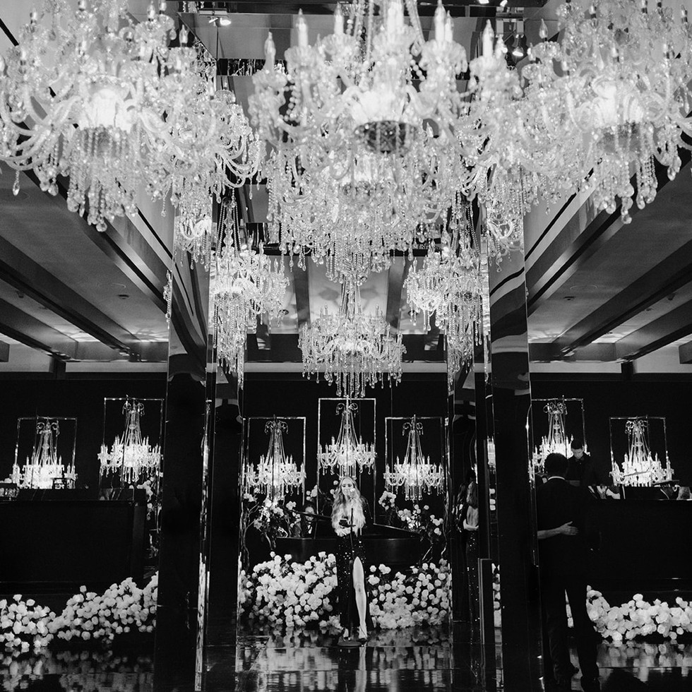 Glamorous wedding design with chandeliers, mirrors, and white florals
