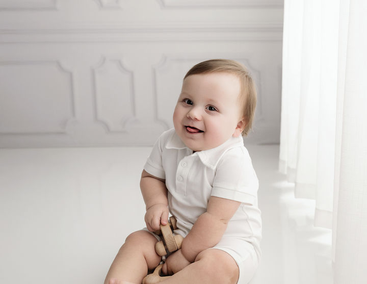 baby boy smiling during a professional studio 
