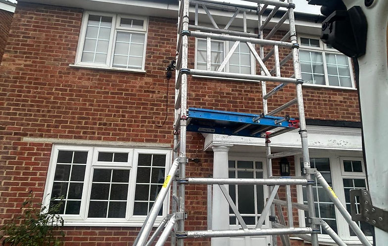 Image of a roofer doing professional roof cleaning work in Leatherhead