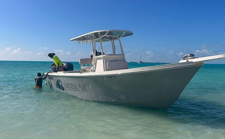 Crystal Bay boat tour, Exuma Bahamas, with people in clear water