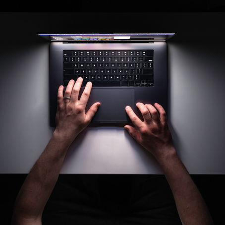 A man using laptop on workplace