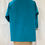 Thumbnail: Cley needle corduroy smock in turquoise with a floral lining.