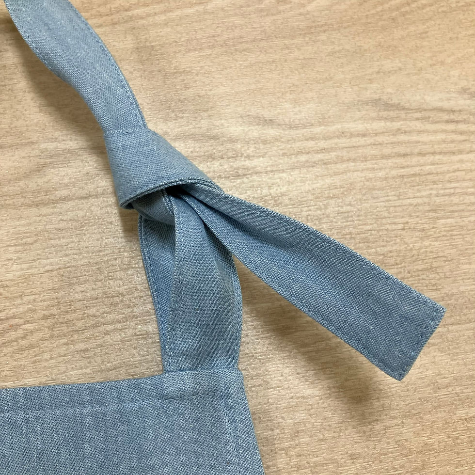 Thumbnail: Kitchen apron in light denim with Liberty Tana lawn trim.