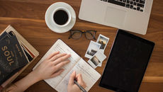 A cosy study scene with open notebook and warm lighting on Bookdio.org