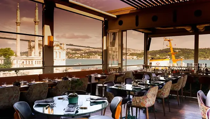 Terrace dining room at Banyan in Ortaköy with Bosphorus and Ortaköy Mosque views.