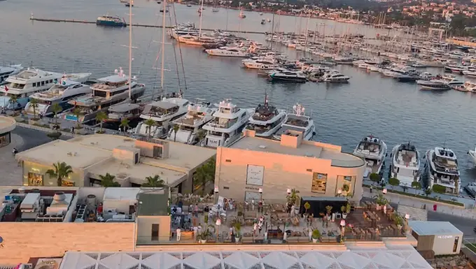Sunset view over Yalıkavak Marina with Novikov Bodrum’s waterfront dining terrace in Bodrum, Muğla.