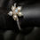 Thumbnail: Flower Ring with Stone and Pearls