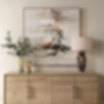 Outburst hand painted canvas above a wooden console table.