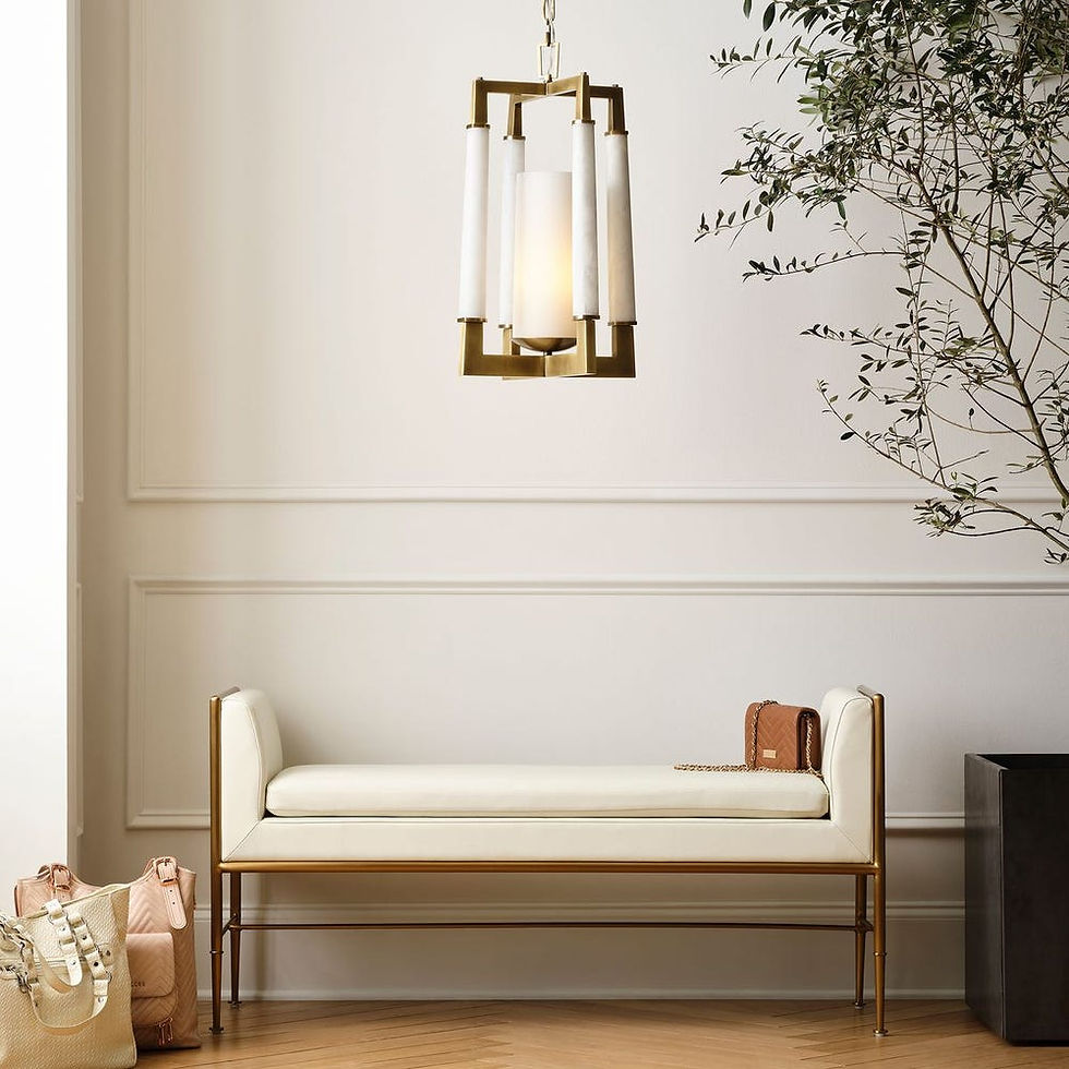 Elegant bench under modern chandelier in a bright, neutral-toned room