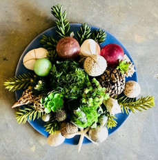 Blue plate with greenery and decorative balls. Inspirations Raleigh