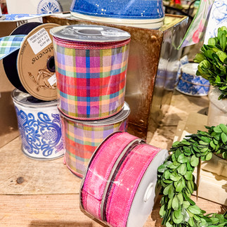 Colorful plaid and pink ribbons, green wreath