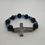 Thumbnail: Blue and black beading with silver cross Forgiven Bracelet.