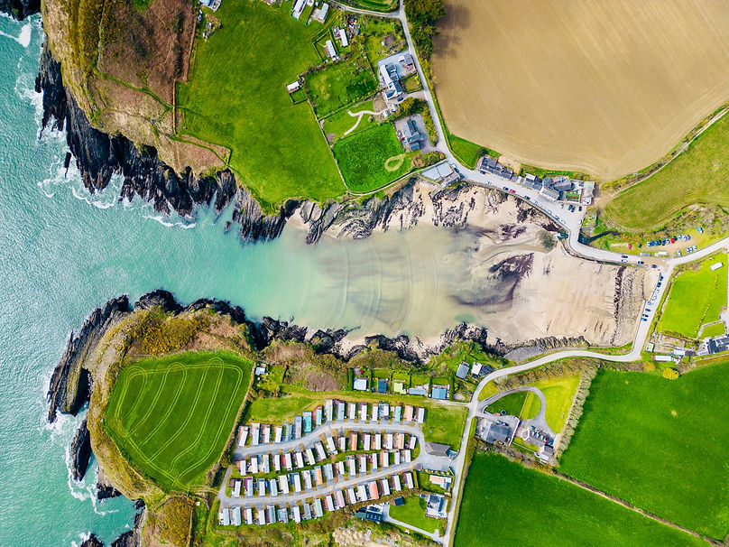 Aerial image of Robert's Cove, showcasing the tranquil waters, picturesque coastline, and lush green surroundings