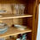 Miniature : Vitrine ancienne en bois clair, portes vitrées et cannage