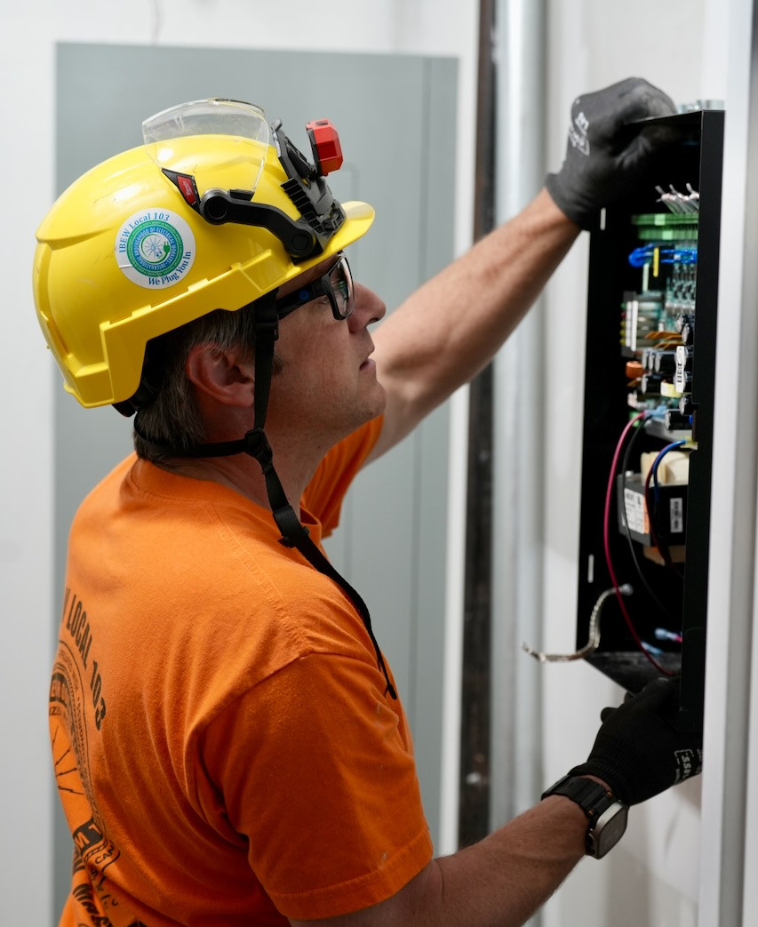 DMS Technician installing Mircom Fire Alarm Box