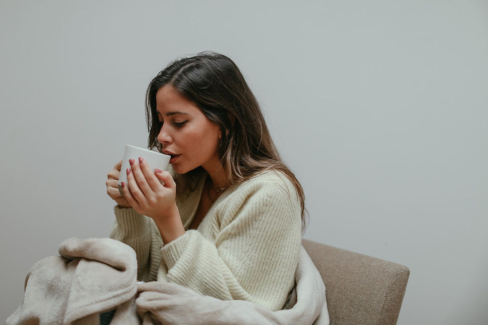 a woman drinking a cup of oolong tea