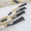 Thumbnail: Lioness Pearl Black and Gold Tassels